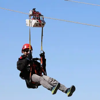 ZipTronik bi-directional zip line trolley in operation